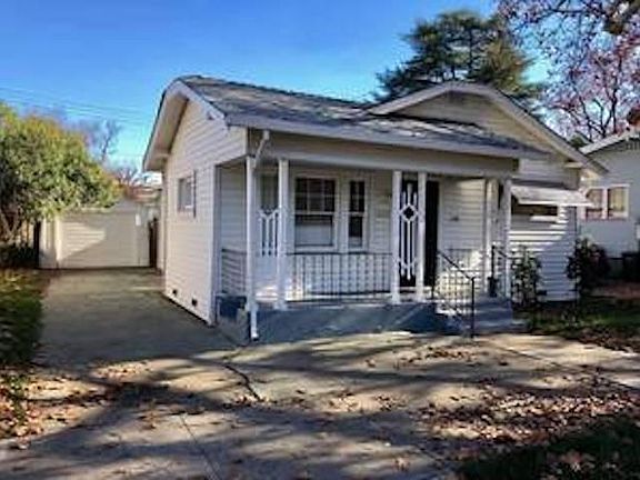 Garage can fit 1 car, plus extra room for storage or workspace. Work bench at the back of the garage.