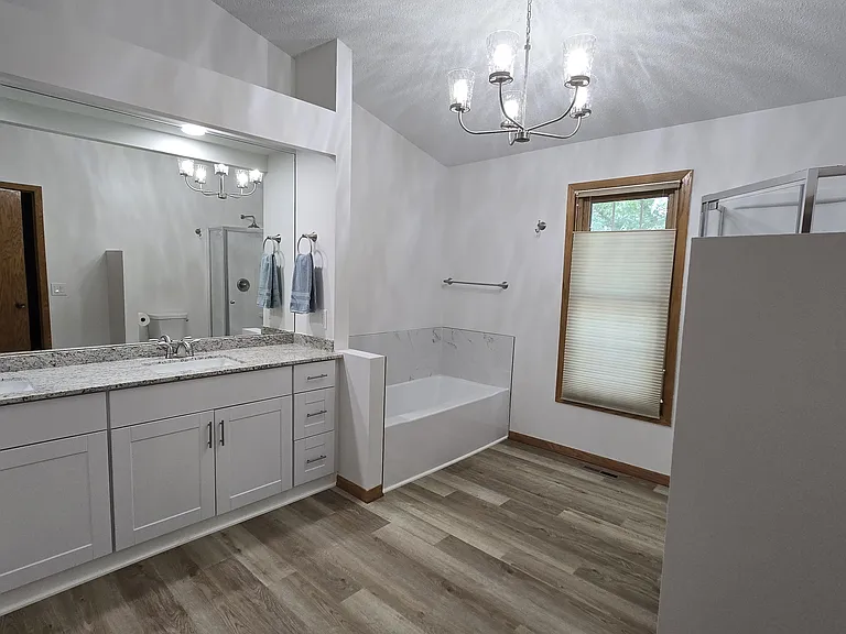 Master bath has a soaking tub and shower.