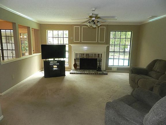 Den with wood burning Fireplace!