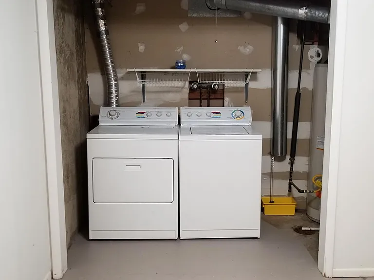 Washer and dryer are included in the downstairs with storage area.