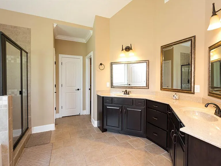 Expansive master bath with large vanity and plenty of cabinet space