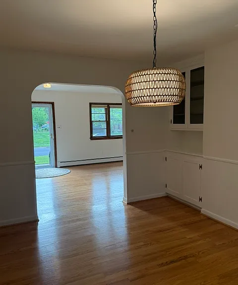 Dining room with buffet cabinet and ship lap paneling.