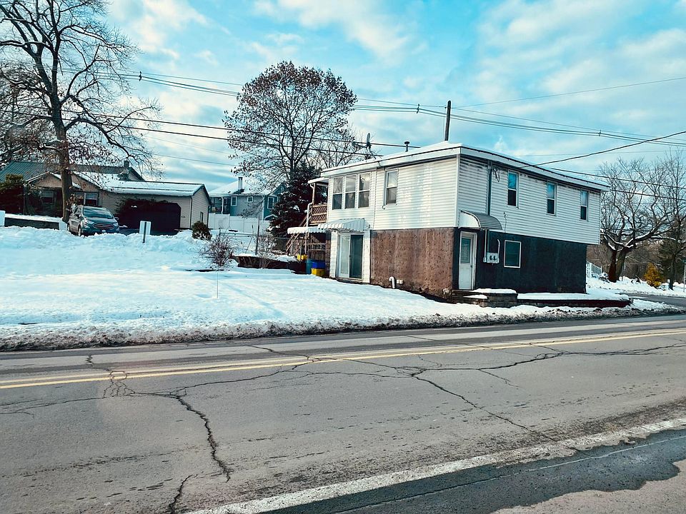outside photo - first floor with 2 paved off street parking spaces