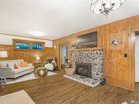 Inviting living room with gorgeous wood paneling. You'll appreciate the original architecture and creative inspiration that enha