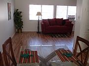 Spacious living and dining room with hardwood floors on main level