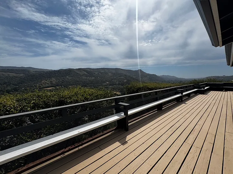 Breathtaking views from Upper-level wrap-around deck.