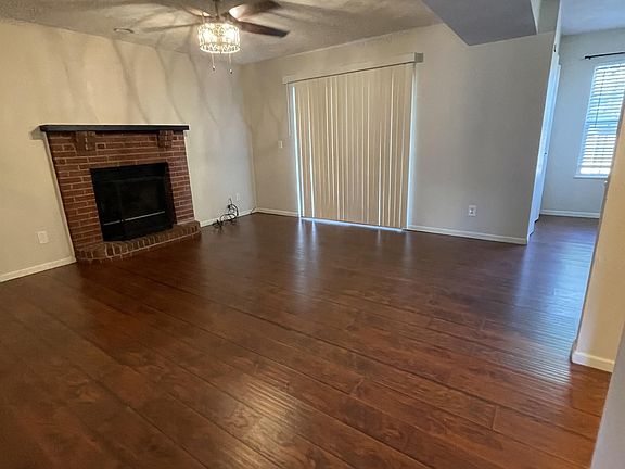 921A Family Room with Gas Fireplace, adjoining kitchen. Patio doors access back patio.