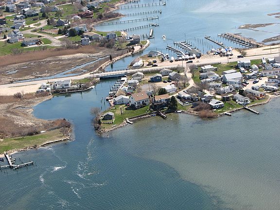 Overhead of house- Cape with the skylights on the corner of pond and channel