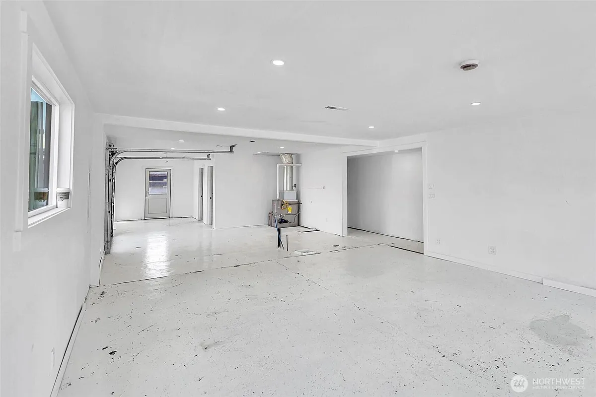 Interior Main Room. Note Water/Drainage and Furnace. - 9808 17th Ave SW