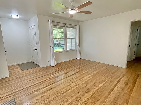 Living room looking eastward onto the front lawn.