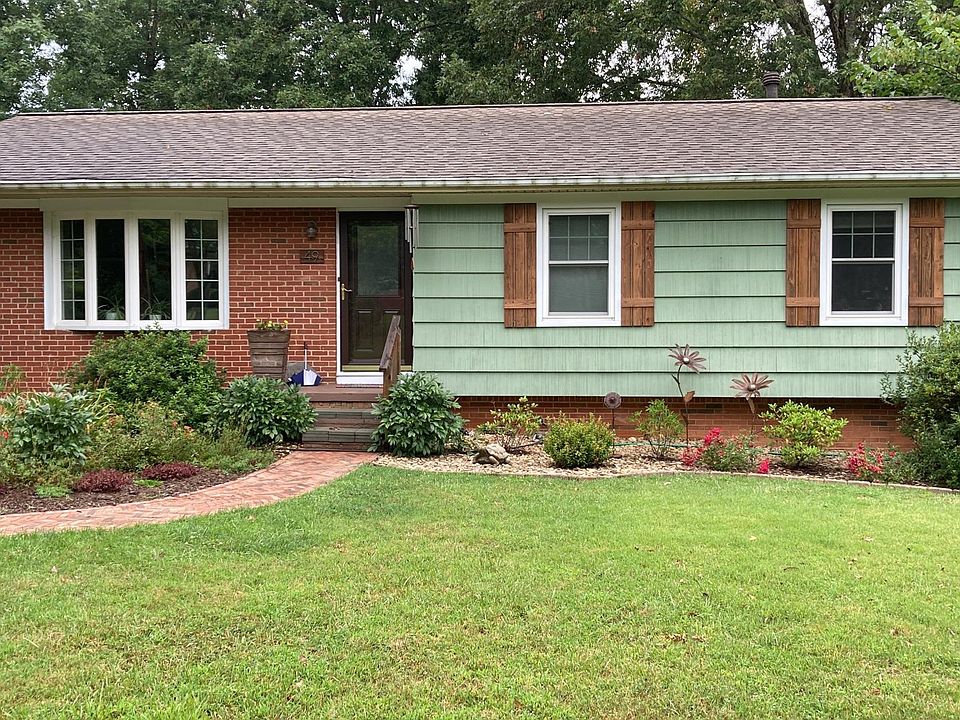 Exterior front. Permeable driveway, brick front walkway. Owner provides front yard lawn maintenance.