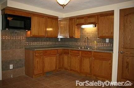 Kitchen : New cabinets ,tile back splash/floor, Delta nickel faucet, some appliances.