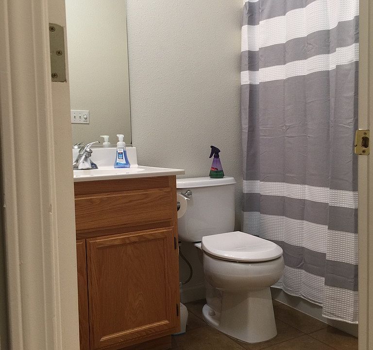 Shared bathroom across bedroom.