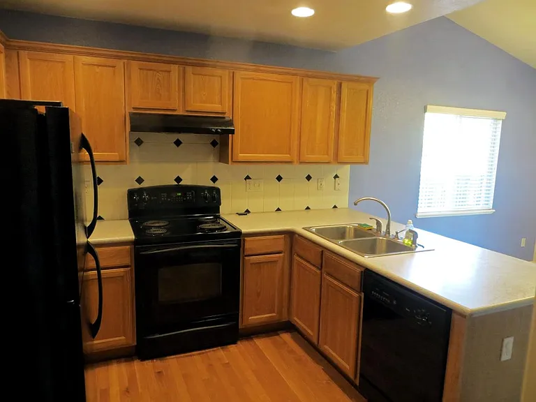 Newer black kitchen appliances included