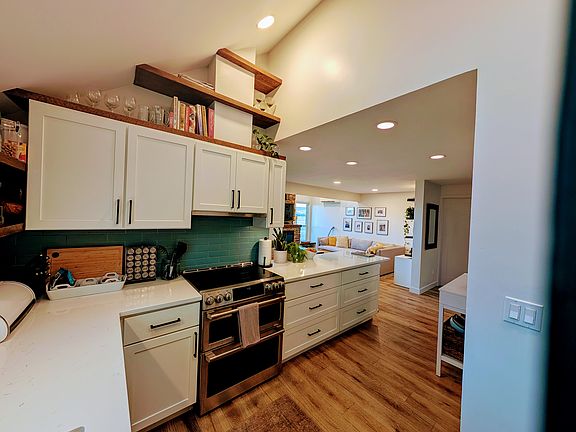 Kitchen with view of the living area. Skylight offers natural light.