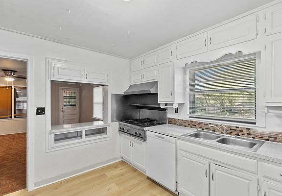 Kitchen with gas stove and grill