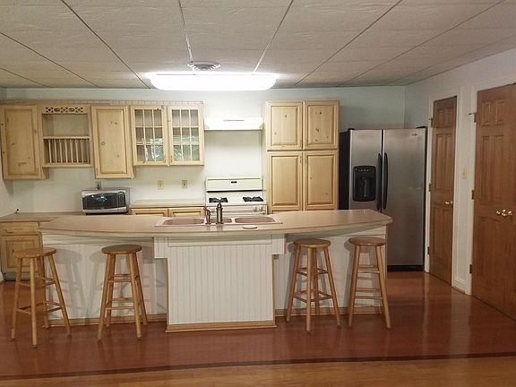 KITCHEN WITH SOLD WOOD CABINETS AND PLENTY OF STORAGE