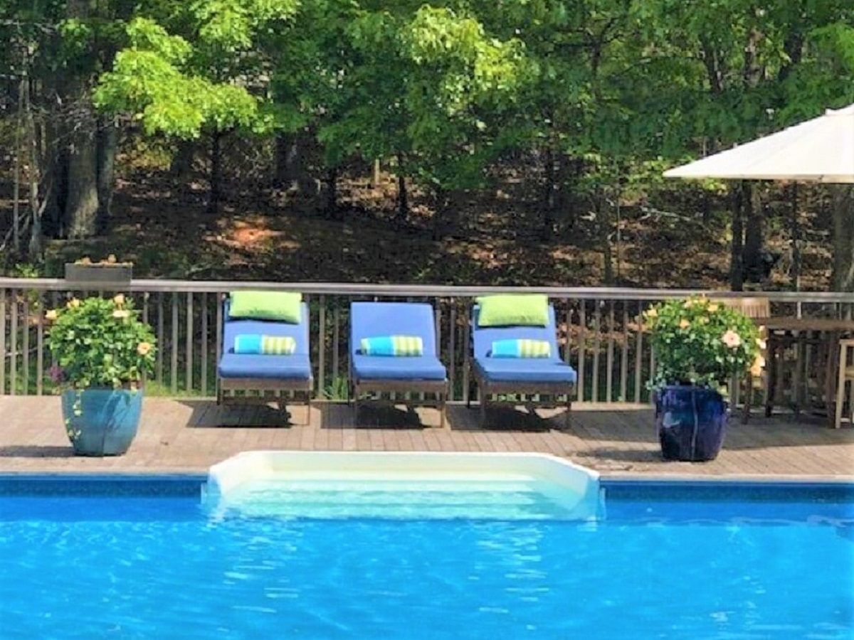  Lounge outside by the pool,multiple large umbrellas