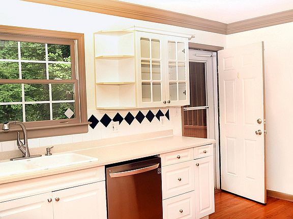 Kitchen opens to large deck