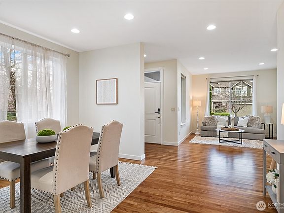 The living and dining rooms connect seamlessly for easy flow entertaining.>