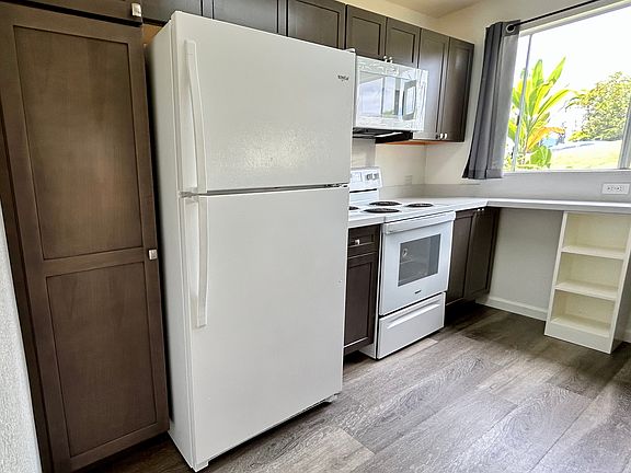 Kitchen with new cabinets, floors and countertop
