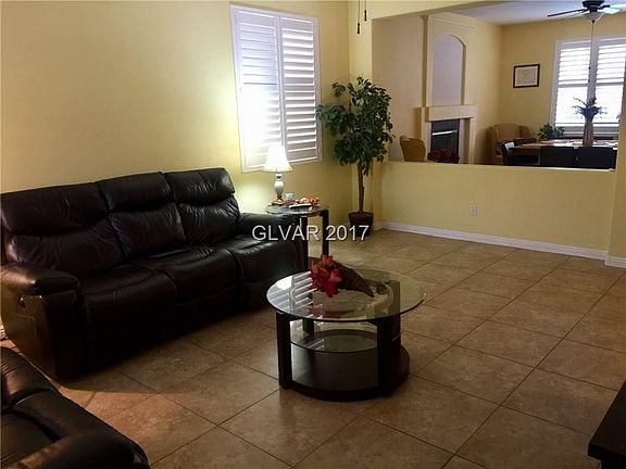 Spacious Living Room with Plantation Shutters and Upgraded Ceramic Flooring