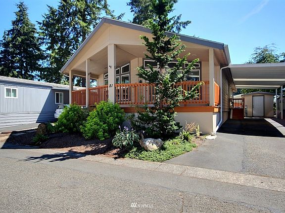 This home also boasts covered parking and lovely mature landscaping.