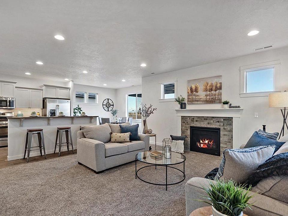 living room NO FIREPLACE in this rental. this photo is from the model home