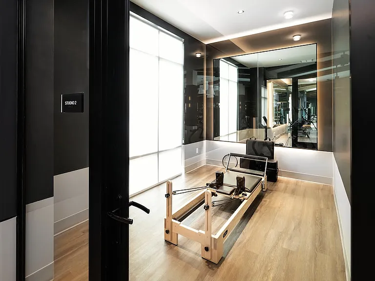 Fitness studio featuring a Pilates reformer
