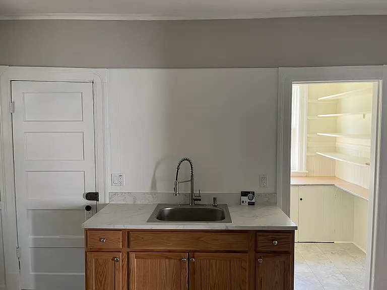 Kitchen to side entryway (left) and pantry (right)