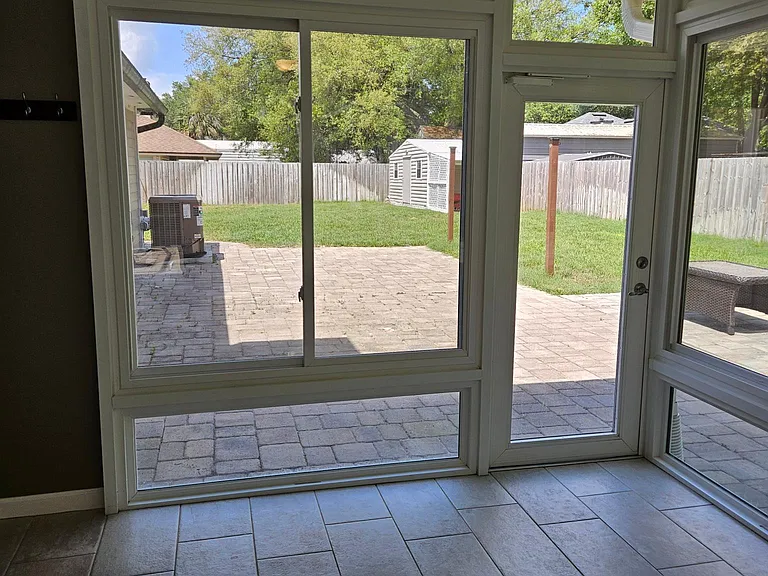 Sunroom exit to the backyard on the left.