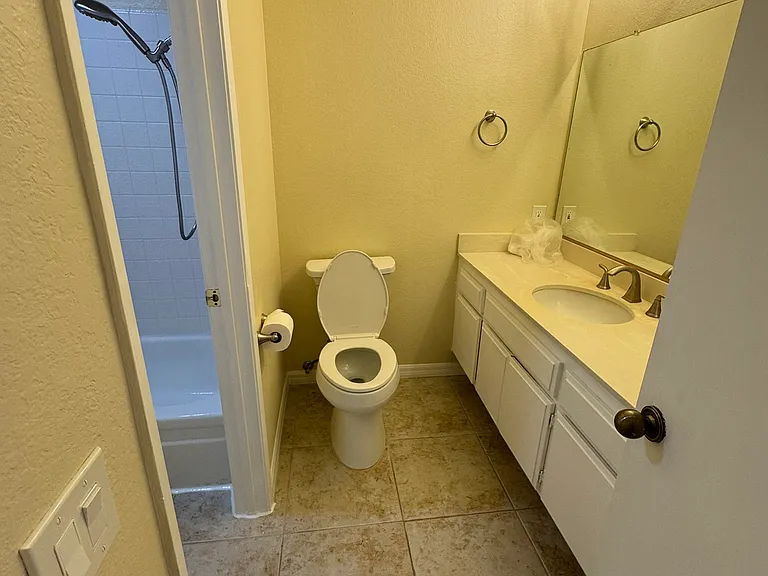 Bathroom 1 with doorway to shared shower