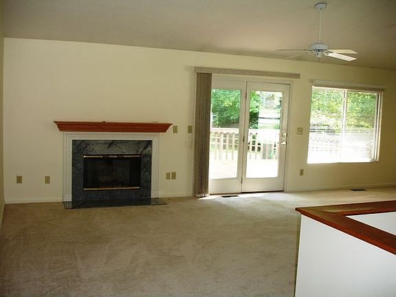 Open Concept Living on the first floor features fp and walkout to deck.