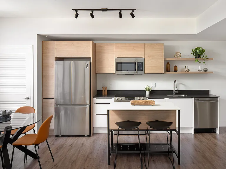 Kitchens feature granite countertops and modern Samsung appliances