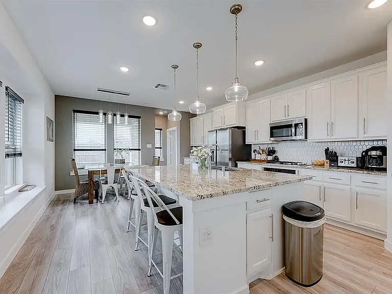 Open concept custom kitchen with gas appliances