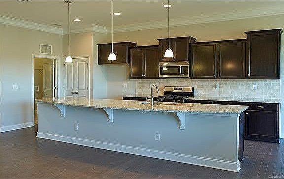 Cabinets are actually white, with white subway tile backspla