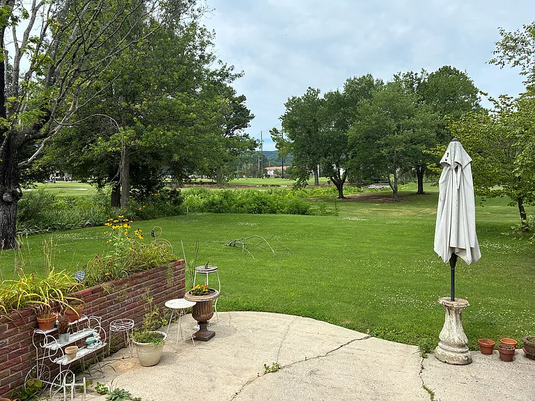 Back porch, looking towards golf course and country club.