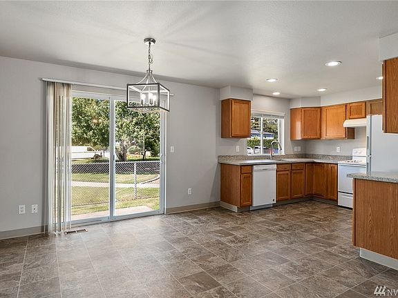 The adjoining dining space is enormous, and is ready to accomodate informal dining, or the largest of gatherings. 