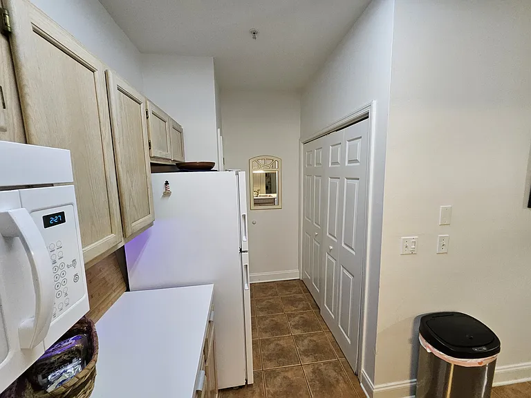 pantry on left after refrigerator. Washer Dryer on right