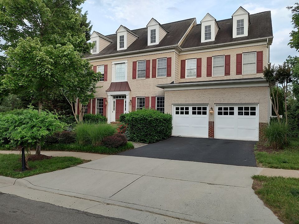Street view of model home, house faces North at the end of the Goshen Farm Court on the cul-de-sac with large 2 car attached garage.