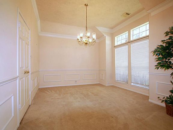 Dining Room with double doors which lead to kitchen.