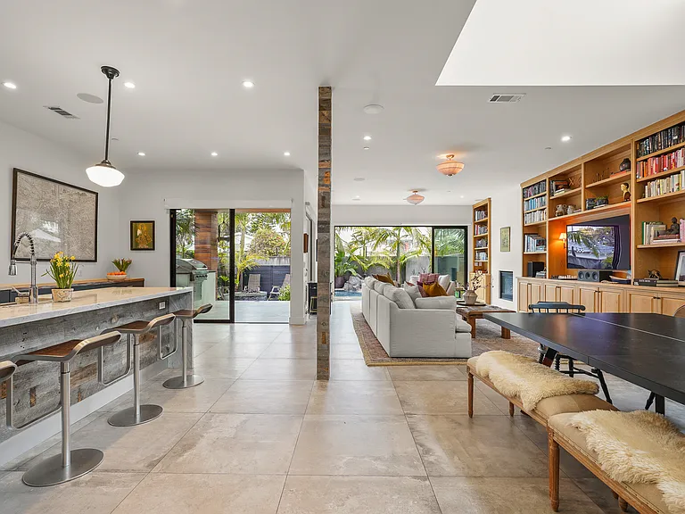 Open floor plan opens to backyard and pool