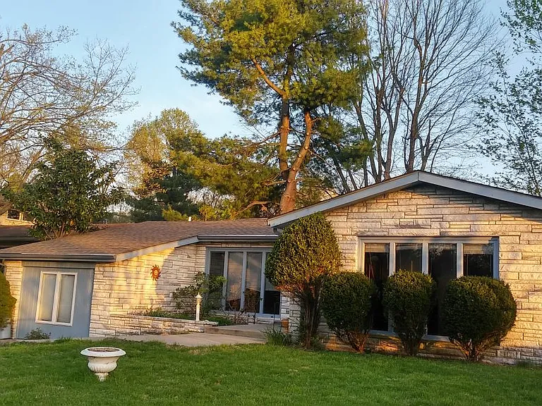 ...with a charming Kentucky home with an inviting curb appeal.