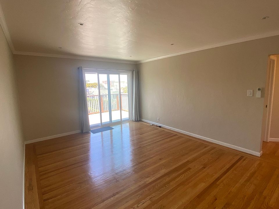 Living room with glass slider to deck