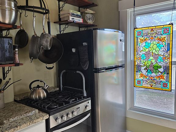 New full-sized refrigerator, new gas stove and oven .