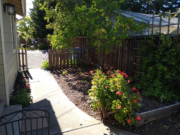 Side yard door and sidewalk to parking area