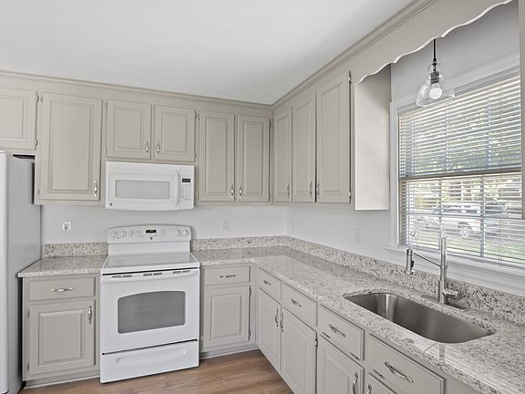 Kitchen features new granite, fresh paint, and new sink with commercial grade faucet.