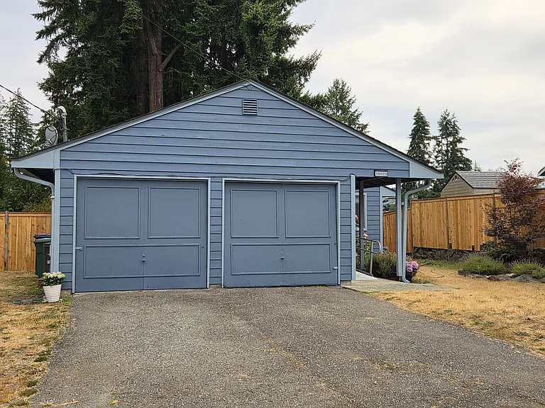 Front of house with large driveway