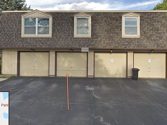 Street view of garage with addition parking space in front