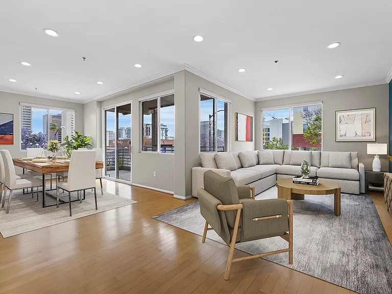 Living/Dining Rooms with Remote Roller Shades (Note: This photo has been virtually staged)